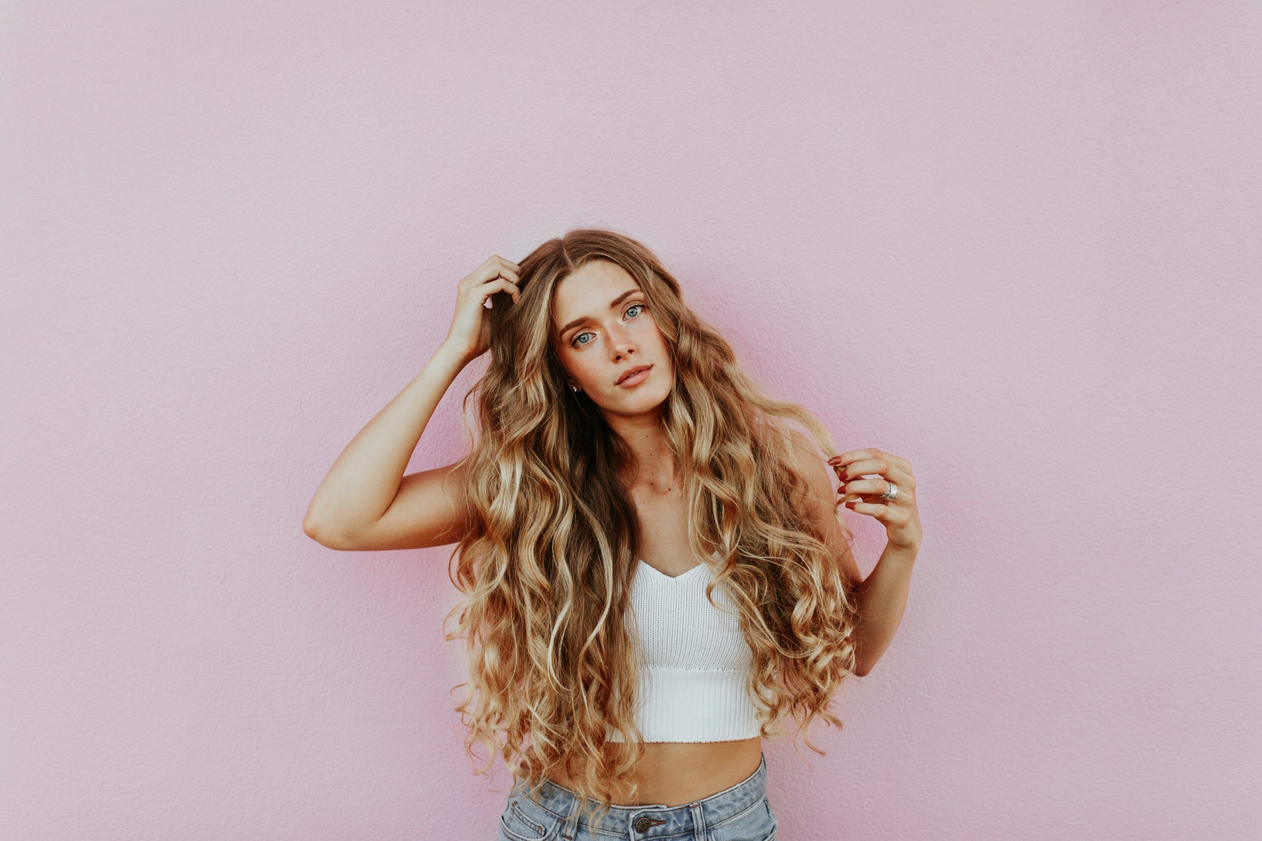 Woman showing long halthy curly hair