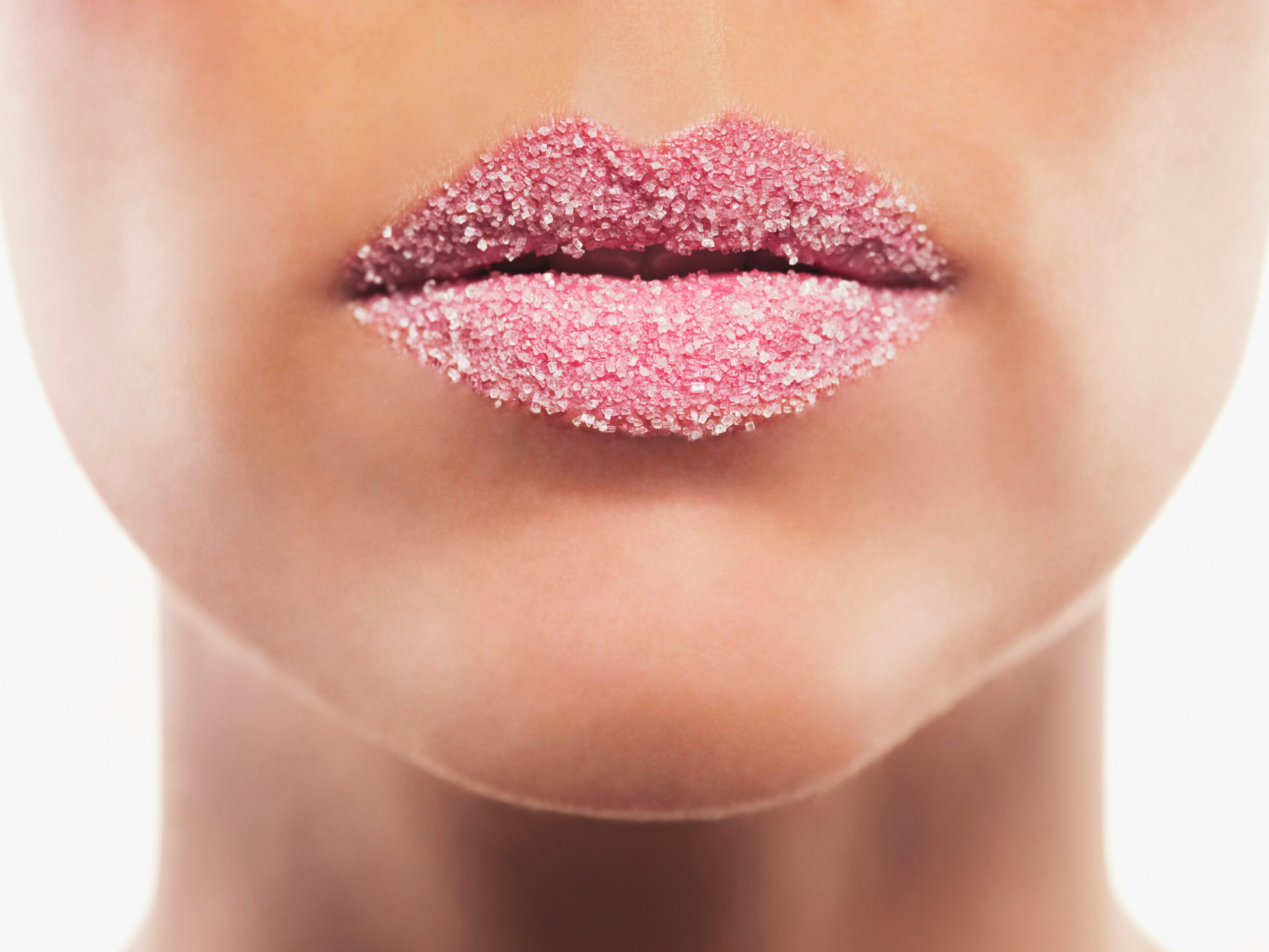 Feminine face showing a lip scrub