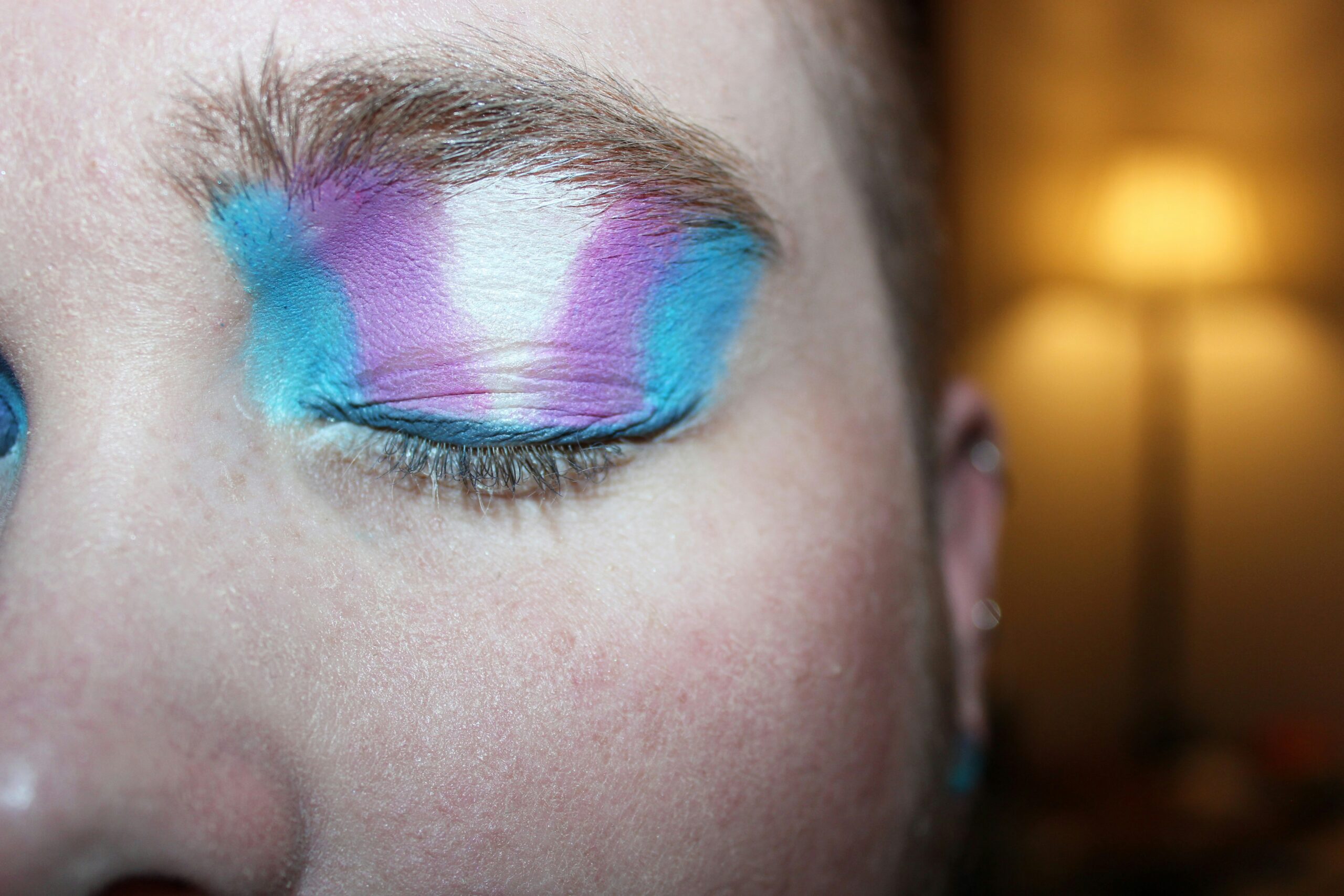 Image showcasing a makeup eye with vibrant eye shadows
