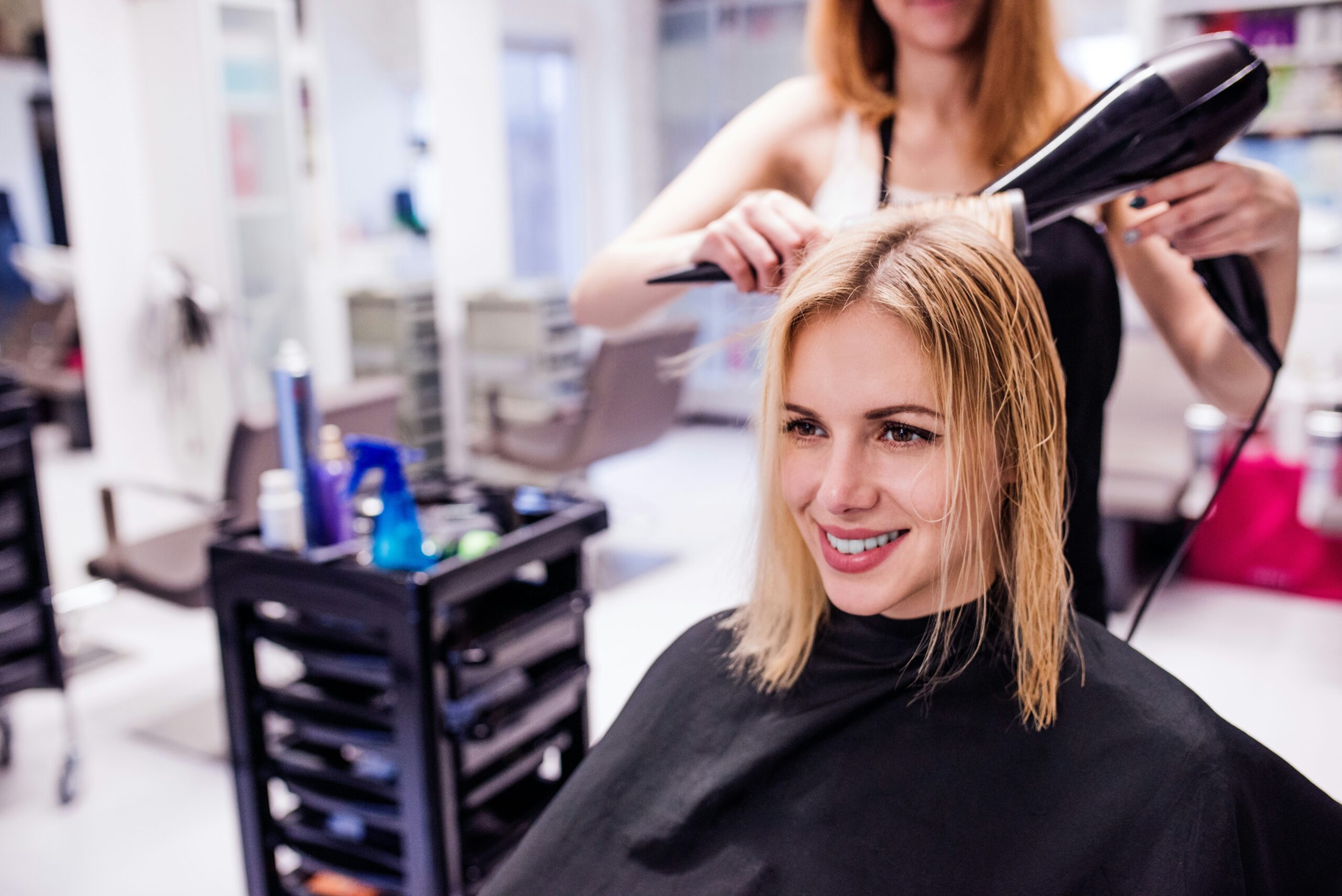 Woman having a haircut with a stylist